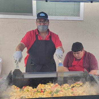Team Ruben's Taco Catering - Ruben cooking the chicken - Caterers Near Me