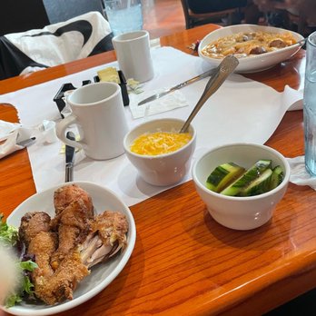 Dame's Chicken & Waffles - Fried chicken, cheese grits and cucumber salad. - Southern Near Me - Durham, North Carolina Dame's Chicken & Waffles - Fried chicken, cheese grits and cucumber salad. - Southern Near Me - Durham, North Carolina