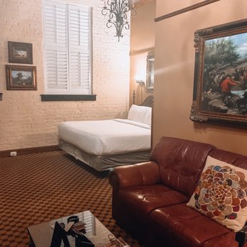 The Ansonborough - Our king suite, high ceilings, wood beams, and exposed brick. - Hotels Near Me - Charleston, South Carolina The Ansonborough - Our king suite, high ceilings, wood beams, and exposed brick. - Hotels Near Me - Charleston, South Carolina