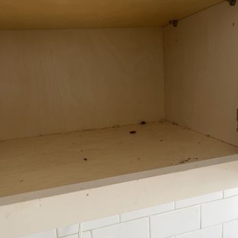 Dustie Corner - Debris inside cabinet not wiped down - Home Cleaning Near Me