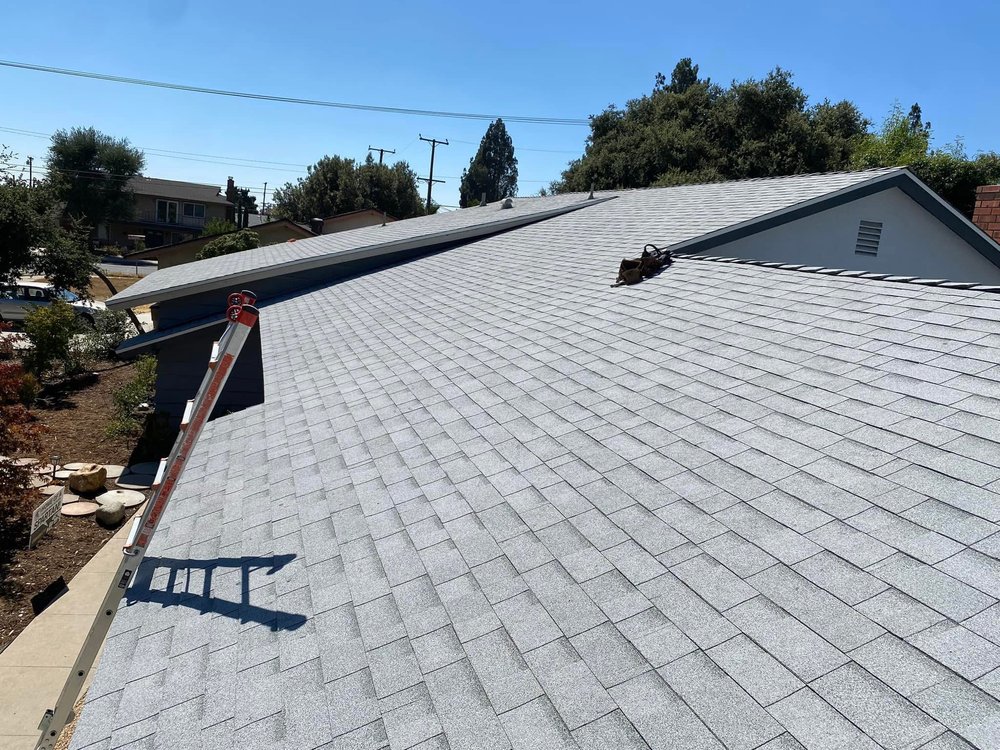 Slide of Tolenco Roofing