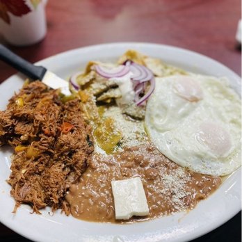 Yolys Mexican Kitchen - Mexican breakfast plate from Yolys Mexican Kitchen featuring savory machaca, two fried eggs, refried beans with cheese, and g... - Mexican Near Me - Downey, California Yolys Mexican Kitchen - Mexican breakfast plate from Yolys Mexican Kitchen featuring savory machaca, two fried eggs, refried beans with cheese, and g... - Mexican Near Me - Downey, California