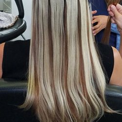 Extensions adhere using medical grade tape. They are very secure and comfortable too.
