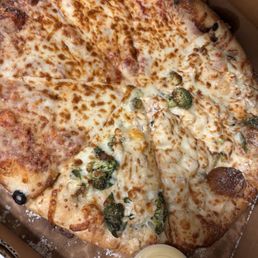 2 X-large pies 1) 1/2 cheese and chicken Alfredo pizza 2) X-large cheese extra sauce Garlic sauce and house made ranch Garlic bread sticks