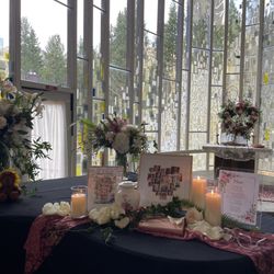 Martha did the large arrangement on left, arrangement behind the photos on piano and the greenery and flowers placed around the candles.