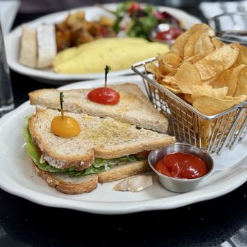 Nisi - Rotisserie Chicken Club - rotisserie chicken, lettuce, tomato, mayo, and honey mustard on sourdough bread, served with chips - Breakfast & Brunch Near Me - New York, New York Nisi - Rotisserie Chicken Club - rotisserie chicken, lettuce, tomato, mayo, and honey mustard on sourdough bread, served with chips - Breakfast & Brunch Near Me - New York, New York
