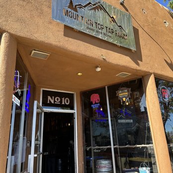 Mountain Top Tap Room - Exterior sign on Route 66 across from train station - Sports Bars Near Me - Flagstaff, Arizona Mountain Top Tap Room - Exterior sign on Route 66 across from train station - Sports Bars Near Me - Flagstaff, Arizona