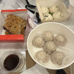 Pork soup dumplings, beef scallion pancake, crispy bottom buns