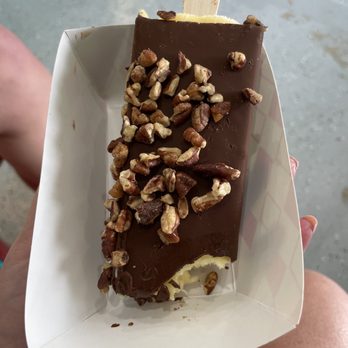 PopsiBar - Coconut/mango bar dipped in Dark Chocolate and pecans on top. - Ice Cream & Frozen Yogurt Near Me - Spring, Texas