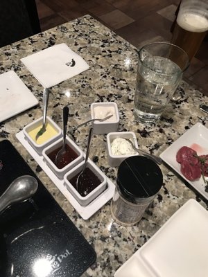 Photo of The Melting Pot - Indianapolis, IN, US. Dips and sauces for the meats