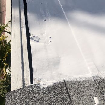First Roofing Contractor - Sloppy work where sealant of metal roof meets new asphalt roofing - Roofing Near Me - Reseda, California