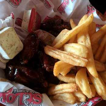St. Louis Bar & Grill - Two pounds of wings on half-price wings on Tuesdays when you buy a drink. Half the wings are sweet chilli. The other half are honey garlic. - Sports Bars Near Me - Toronto, Ontario