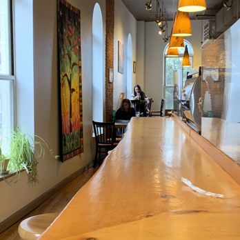 Arabica Coffee - a long wooden table in a coffee shop - Coffee & Tea Near Me - Portland, Maine Arabica Coffee - a long wooden table in a coffee shop - Coffee & Tea Near Me - Portland, Maine