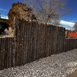 Henry’s Tree Experience - Custom Coyote fence made with Cedar Latillas  and metal cemented posts.