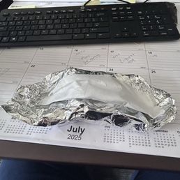 Wrapping keeps it hot and has a liner to soak up any spills Wrapping keeps it hot and has a liner to soak up any spills
