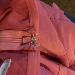 Alterations Unlimited - The zipper wouldn't even close and the sides has puffs on the side of the dress after they altered it..they RUINED it completely