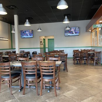Wingstop - Clean tables with large TVs - Chicken Wings Near Me - Houston, Texas
