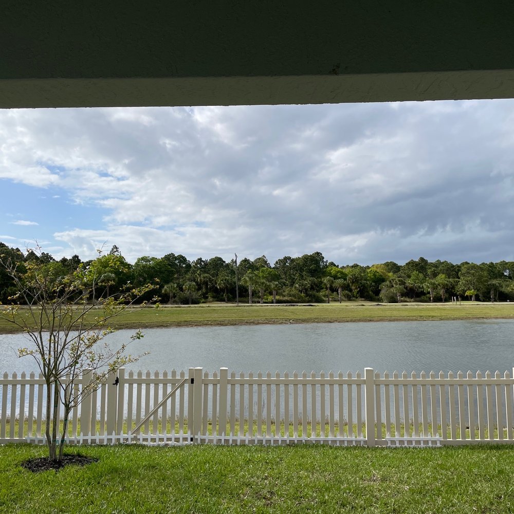 Fence Outlet - The white fence at the bottom is due to a lack of sod installed - Fences & Gates Near Me - Melbourne, Florida Fence Outlet - The white fence at the bottom is due to a lack of sod installed - Fences & Gates Near Me - Melbourne, Florida