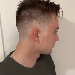 Gent Cuts and Grooming - You can see the red skin malformation that was struck several times. Also how high and tight the haircut was taken