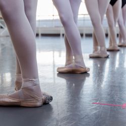 Omaha Academy of Ballet - Pointe dancers lined up at the barre.
