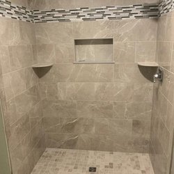 Recent bathroom remodel project including tile, recessed lighting and shower design.