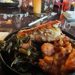 Lobster, collard greens and yams with sweet iced tea. Lobster, collard greens and yams with sweet iced tea.