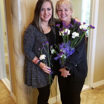 Tranquility Dental - My dental hygienist, Martha, and I with Mother's day flowers they are giving all mothers. - General Dentistry Near Me - McKinney, Texas