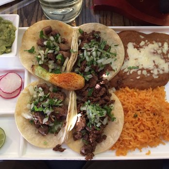 Tequila Real Mexican Grill - Taco dinner platter: 2 Lengua tacos (L) and 2 Carne Asada (R), beans & rice - Mexican Near Me - Milton, Delaware Tequila Real Mexican Grill - Taco dinner platter: 2 Lengua tacos (L) and 2 Carne Asada (R), beans & rice - Mexican Near Me - Milton, Delaware