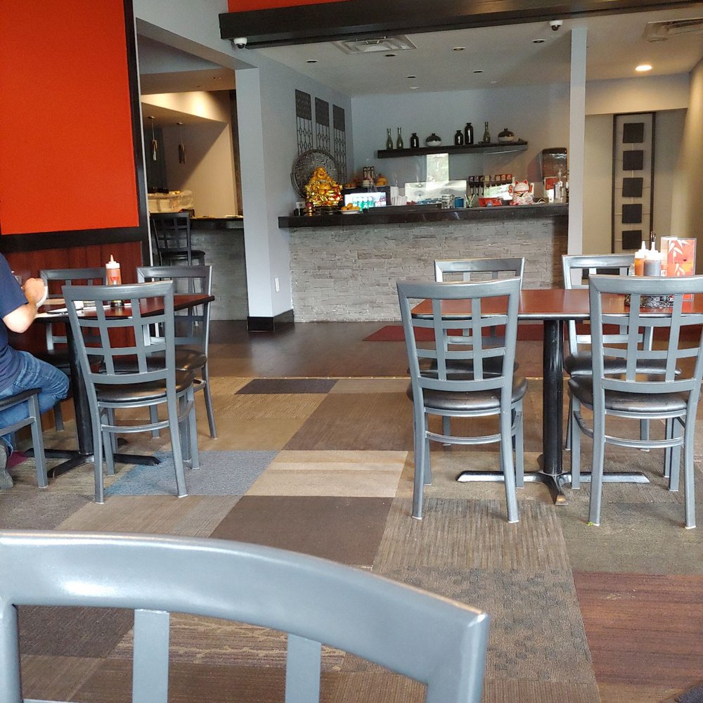 a man sitting at a table in a restaurant