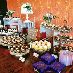 Easy Street Bakery - Beautiful wedding sweets table with a variety of cupcakes and a cutting cake.