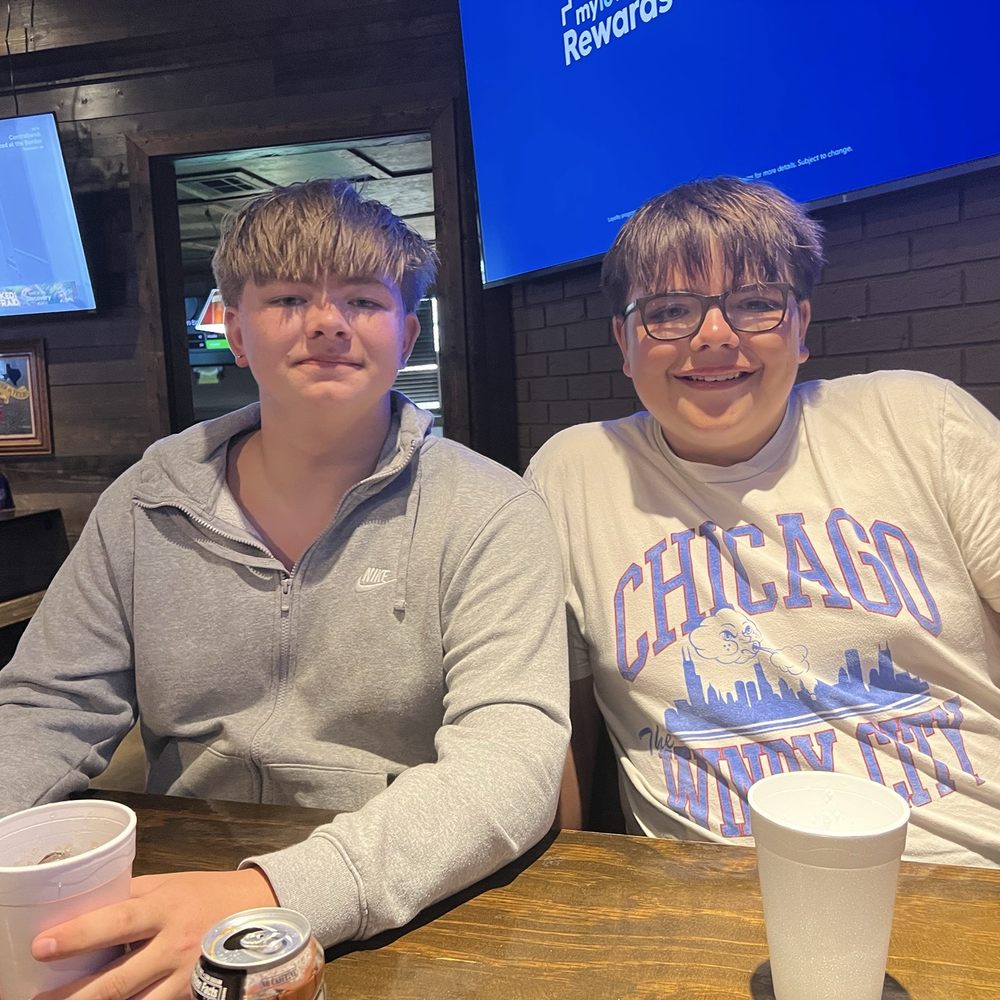 Randy's Ice House - Two happy teens waiting for their burgers and sharing a basket of fries!!! - American Near Me - Taylor, Texas Randy's Ice House - Two happy teens waiting for their burgers and sharing a basket of fries!!! - American Near Me - Taylor, Texas