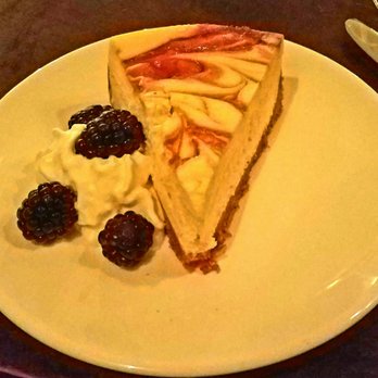 Agustin Kitchen - Cheesecake $10 Berry swirled with cointreauwhipped cream and fresh berries - New American Near Me - Tucson, Arizona