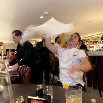 Crazy Pizza - This guy even took a seat at our table to show off his dough-tossing skills.  He did not chip in to our bill. - Pizza Near Me - East Hampton, New York