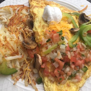 Tony's Diner - Southwestern Omelette-topped with pico, cheese, and sour cream--yum! - Diners Near Me - Minneapolis, Minnesota