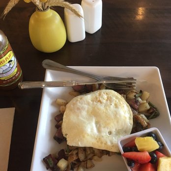 Feed Cafe - Pastrami hash with eggs over medium and a side of fruit instead of bread. - Breakfast & Brunch Near Me - Bozeman, Montana