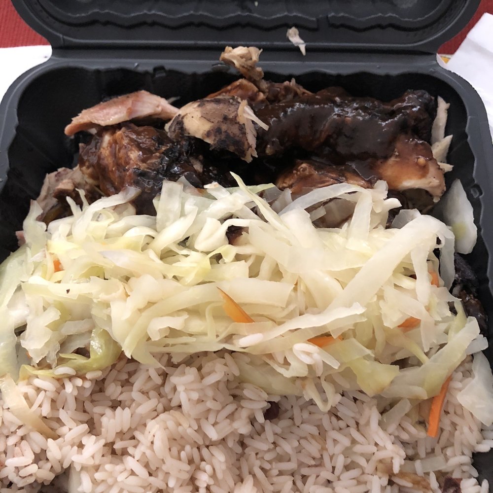 Jerk chicken, rice and peas, steamed cabbage Jerk chicken, rice and peas, steamed cabbage