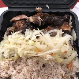 Jerk chicken, rice and peas, steamed cabbage Jerk chicken, rice and peas, steamed cabbage