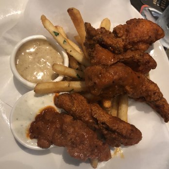 Yard House - Fried Chicken Tenders from happy hour menu tossed in buffalo sauce - Bars Near Me - Houston, Texas Yard House - Fried Chicken Tenders from happy hour menu tossed in buffalo sauce - Bars Near Me - Houston, Texas