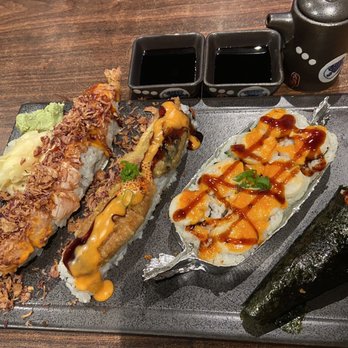 MJ Sushi - Left to right: warriors roll, crunchy eel roll, baked scallop roll, and shrimp tempura hand roll - Sushi Bars Near Me - Fremont, California MJ Sushi - Left to right: warriors roll, crunchy eel roll, baked scallop roll, and shrimp tempura hand roll - Sushi Bars Near Me - Fremont, California