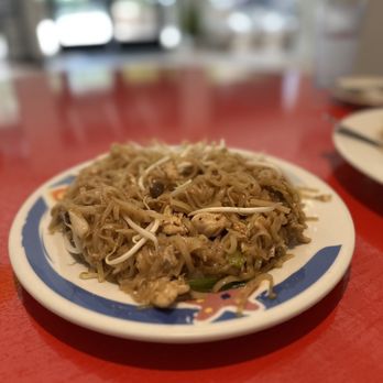 Sea By Thai - a plate of noodles on a red table - Thai Near Me - Glen Allen, Virginia