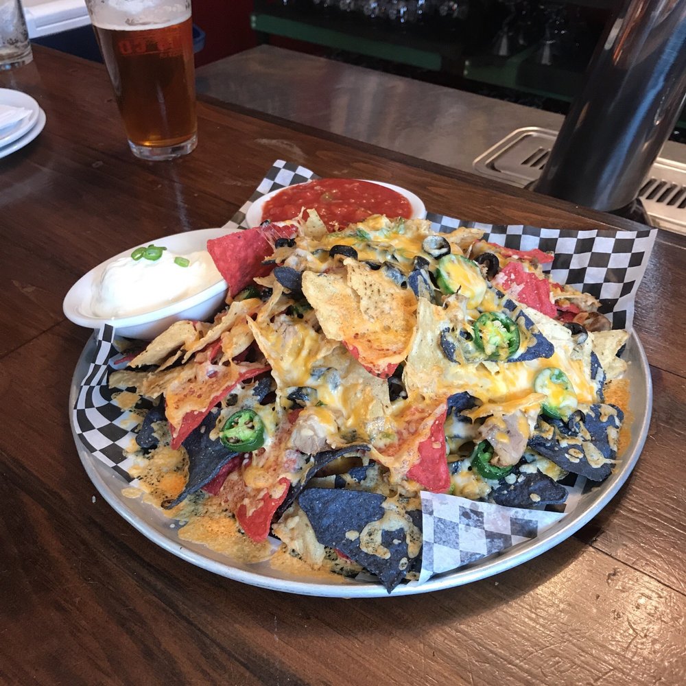Groundswell Pub - a plate of nachos and a glass of beer - Pubs Near Me - D'Escousse, Nova Scotia