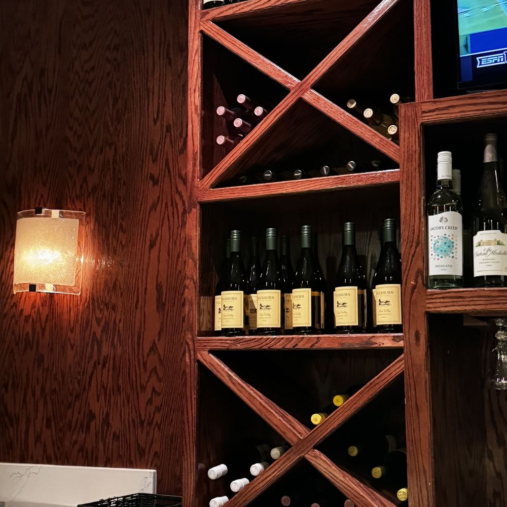 Bonefish Grill - a wine rack with bottles of wine - Seafood Near Me - Durham, North Carolina