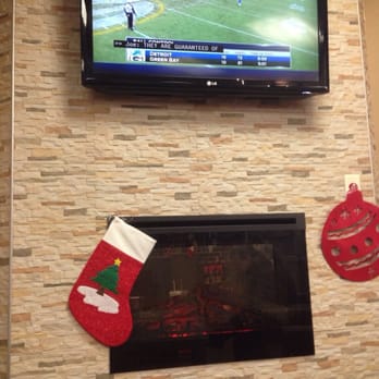 Tim Hortons - a television mounted above a fireplace - Donuts Near Me - Warren, Michigan Tim Hortons - a television mounted above a fireplace - Donuts Near Me - Warren, Michigan