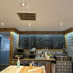 a chalkboard menu on the wall a chalkboard menu on the wall