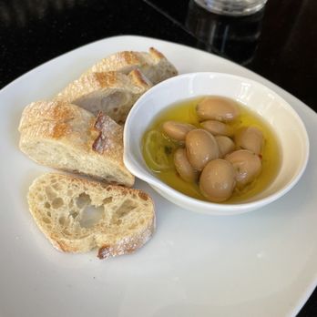 Bistro Ten - Complimentary app: butter beans in oil and garlic with bread on the side - Wine Bars Near Me - Beaufort, South Carolina