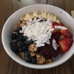 Río Açai Bowls - The Rio Bowl, large in a glass bowl. Has strawberries, blueberries, bananas, granola, coconut shavings, honey, and açaí
