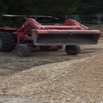 Rockin' W Tractor Services - red tractor with a plow attachment - General Contractors Near Me Rockin' W Tractor Services - red tractor with a plow attachment - General Contractors Near Me