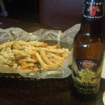 Pubgrill - Don't be tongue tied, stuff your face with truffle permesan fries followed by a nice golden monkey. - Burgers Near Me - Cutler Bay, Florida