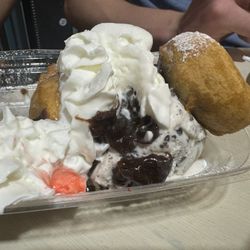 Hershey's Ice Cream Shop - Fried Oreo sundae--three fried Oreos, cookies and cream ice cream, hot fudge, the pink is from the cherry :)