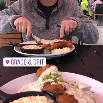 Grace & Grit - My husband and I enjoying the fried chicken biscuit with gravy and pimento cheese grits - Southern Near Me - Mount Pleasant, South Carolina